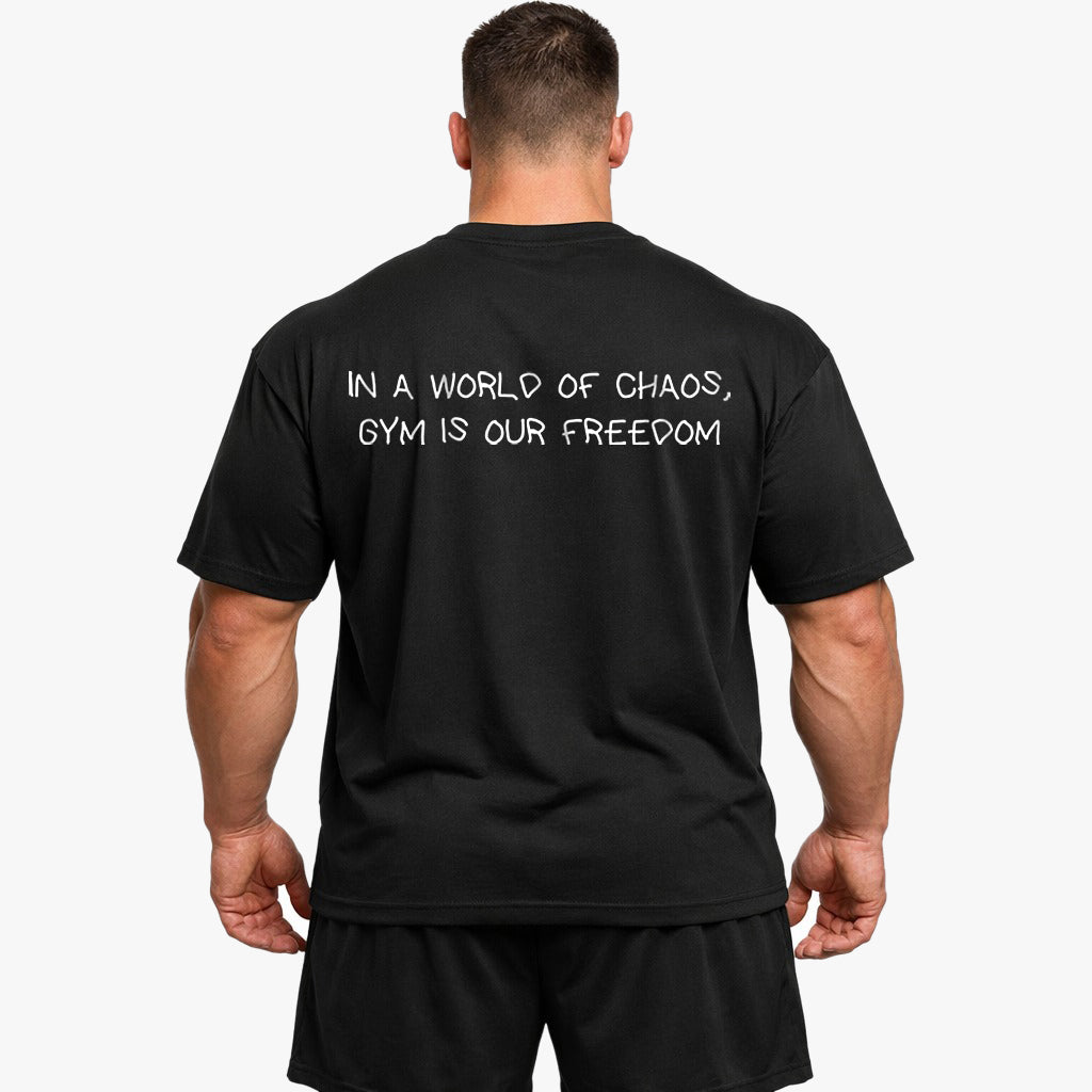 IN A WORLD OF CHAOS, GYM IS OUR FREEDOM Oversized (Backprint) Shirt
